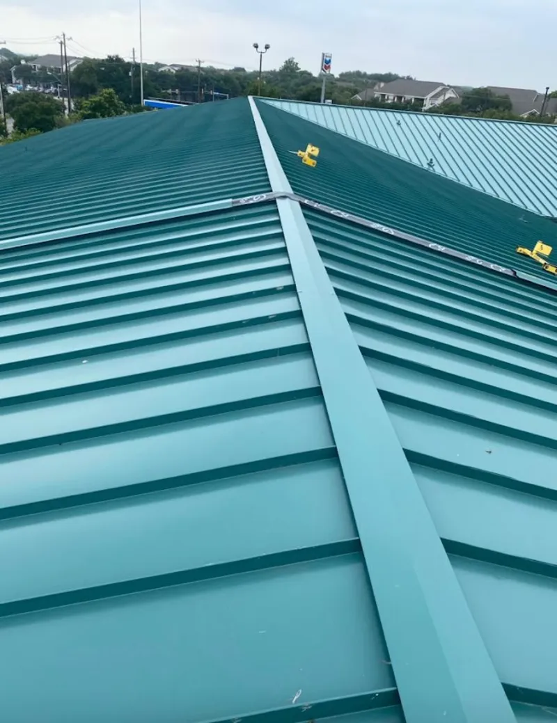 Green commercial metal roof ridge and valley for Metal Roof Repair in Wellsville